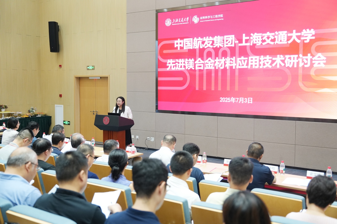 A person standing at a podium giving a presentation
Description automatically generated